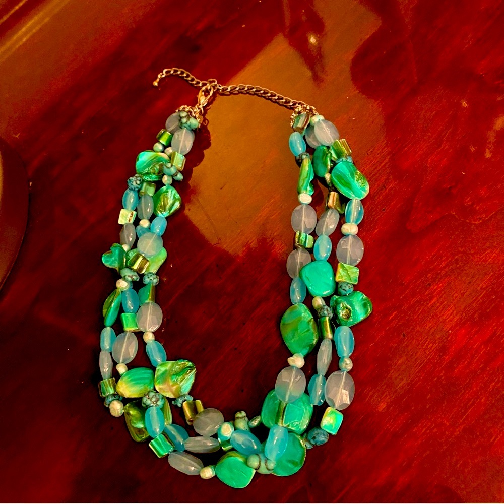 Three strand multi colored necklace. Silver tone, claw clasp.